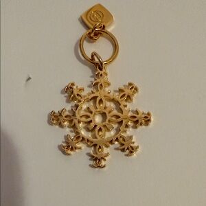 CHANEL Snowflake Gold Charm. Has double C all around and on tag! Elegant Pendant